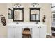 Bathroom vanity with double sinks, vanity area, and matching mirrors at 6352 W Hackamore Dr, Phoenix, AZ 85083