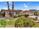 Beautiful single-story home with colorful landscaping, a well-manicured lawn, and a spacious two-car garage at 6352 W Hackamore Dr, Phoenix, AZ 85083