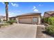 Welcoming single-story home with a well-maintained lawn, desert landscaping, and a spacious two-car garage at 6352 W Hackamore Dr, Phoenix, AZ 85083