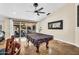 Entertaining game room with a pool table, neutral walls, and access to the outdoor patio area at 6352 W Hackamore Dr, Phoenix, AZ 85083