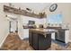 Spacious kitchen with white cabinetry, granite countertops, and stainless steel appliances at 6352 W Hackamore Dr, Phoenix, AZ 85083