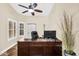 Office space featuring plantation shutters, neutral paint, and a ceiling fan at 6352 W Hackamore Dr, Phoenix, AZ 85083