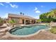A large pool surrounded by lush landscaping and a covered patio area perfect for outdoor entertaining at 6352 W Hackamore Dr, Phoenix, AZ 85083