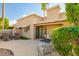 Beautifully landscaped backyard with lush greenery and comfortable lounge chairs, creating a serene escape at 6611 N 79Th Pl, Scottsdale, AZ 85250