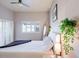 Comfortable bedroom with a cozy bed, neutral tones, white shutters, and ample natural light at 6611 N 79Th Pl, Scottsdale, AZ 85250