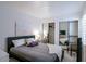 Bedroom featuring a cozy bed, mirrored closet doors, and soft natural light at 6611 N 79Th Pl, Scottsdale, AZ 85250