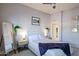 Serene bedroom with minimalist decor, light gray walls, and a plush throw blanket for a cozy vibe at 6611 N 79Th Pl, Scottsdale, AZ 85250