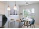 Cozy breakfast nook near the kitchen with bright windows and seating for four people at 6611 N 79Th Pl, Scottsdale, AZ 85250