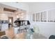 Kitchen with white cabinets, granite countertops, and breakfast bar seating near a window at 6611 N 79Th Pl, Scottsdale, AZ 85250