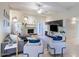 Bright living area with neutral colors, modern furnishings, and a fireplace with entertainment center at 6611 N 79Th Pl, Scottsdale, AZ 85250