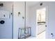 Bright shower with blue tiling, plants, chrome hardware, and a glass enclosure to create a spa-like feel at 6611 N 79Th Pl, Scottsdale, AZ 85250