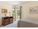 Bright bedroom with large window offers plenty of natural light and lovely backyard views at 6717 E Aire Libre Ln, Scottsdale, AZ 85254