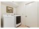 Well-lit laundry room features a modern Samsung washer and dryer set, with neutral wall paint and flooring at 6717 E Aire Libre Ln, Scottsdale, AZ 85254