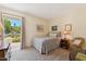 Comfortable bedroom featuring neutral colors, a sunny window, and ample space at 6717 E Aire Libre Ln, Scottsdale, AZ 85254