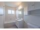 Clean bathroom featuring a shower/tub combo, and a vanity with ample storage space at 7035 N 11Th Pl, Phoenix, AZ 85020