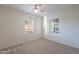 Carpeted bedroom featuring dual windows with blinds for natural light and ventilation at 7035 N 11Th Pl, Phoenix, AZ 85020