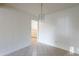 Neutral dining room with tile flooring and a view into the adjacent kitchen at 7035 N 11Th Pl, Phoenix, AZ 85020