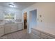 Classic kitchen with tile countertops, white cabinets and a double basin stainless steel sink at 7035 N 11Th Pl, Phoenix, AZ 85020