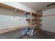 This storage room features unfinished walls and a lot of shelving for your stuff at 7035 N 11Th Pl, Phoenix, AZ 85020
