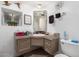 Cozy bathroom featuring a sink, mirror, decorative wall art, and natural light from a window at 7343 E Juanita Ave, Mesa, AZ 85209