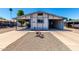 Charming home featuring a carport, lovely desert landscaping, and an inviting entrance at 7343 E Juanita Ave, Mesa, AZ 85209