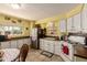 Functional kitchen with ample counter space, practical appliances, and a cozy dining nook at 7343 E Juanita Ave, Mesa, AZ 85209
