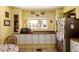 Bright kitchen with view of a manufactured home community at 7343 E Juanita Ave, Mesa, AZ 85209