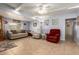 Inviting living room with comfortable seating, neutral colors, and tile flooring at 7343 E Juanita Ave, Mesa, AZ 85209