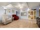 Cozy living room featuring tiled floors, ceiling fan, and plenty of natural light at 7343 E Juanita Ave, Mesa, AZ 85209