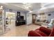Comfortable living room showcasing an open layout, tile flooring, and seamless flow at 7343 E Juanita Ave, Mesa, AZ 85209