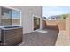 Private backyard with gravel and view of neighboring houses at 7427 S 75Th Ln, Laveen, AZ 85339