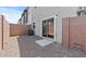 Enclosed backyard with gravel, brick walls, and sliding glass door at 7427 S 75Th Ln, Laveen, AZ 85339