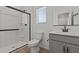 Modern bathroom with stylish vanity, glass shower, and neutral color palette at 7427 S 75Th Ln, Laveen, AZ 85339