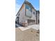 Side view of a two-story home with a two-car garage and a tidy stone covered yard at 7427 S 75Th Ln, Laveen, AZ 85339