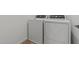 Laundry area features a white washer and dryer set at 7427 S 75Th Ln, Laveen, AZ 85339