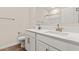 Spacious bathroom with double vanity, modern faucets, and wood-look tile flooring at 7428 S 75Th Ln, Laveen, AZ 85339