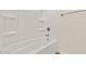 Clean white bathtub and shower combination with shelving for added convenience at 7428 S 75Th Ln, Laveen, AZ 85339