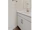 This bathroom features a white vanity with a solid surface countertop and a silver faucet at 7428 S 75Th Ln, Laveen, AZ 85339