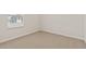Bright bedroom with neutral carpet, white walls, and a window for natural light at 7428 S 75Th Ln, Laveen, AZ 85339