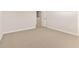 A spacious bedroom with neutral carpet, white walls, and baseboards provides a blank canvas at 7428 S 75Th Ln, Laveen, AZ 85339