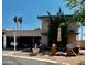 Inviting two-story home featuring a covered car port, balcony, and charming outdoor seating area at 7607 E Bonita Dr, Scottsdale, AZ 85250