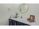 Chic powder room features marble counters, gold fixtures, and decorative accents at 7716 S Rita Ln, Tempe, AZ 85284