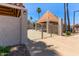 Pool gate with a gazebo and desert landscaping showing the pool entrance at 7716 S Rita Ln, Tempe, AZ 85284