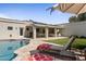 Private backyard oasis featuring a sparkling swimming pool, covered patio and lounge chairs at 8343 E Quarterhorse Trl, Scottsdale, AZ 85258