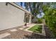 Charming backyard featuring stone pavers, decorative gravel, and artificial turf at 8343 E Quarterhorse Trl, Scottsdale, AZ 85258