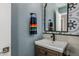 Charming bathroom with modern sink, mirror and a colorful towel displayed at 8343 E Quarterhorse Trl, Scottsdale, AZ 85258