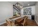 Bright dining area with modern lighting, built-in cabinets, and golf course views at 8343 E Quarterhorse Trl, Scottsdale, AZ 85258
