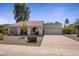 Inviting single-Gathering home with a well-maintained front yard and a two-car garage at 8343 E Quarterhorse Trl, Scottsdale, AZ 85258
