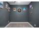 Finished basement game room with modern gray walls, dart board and neon bar sign at 8343 E Quarterhorse Trl, Scottsdale, AZ 85258