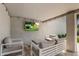 Cozy outdoor living space with comfortable seating and a mounted television at 8343 E Quarterhorse Trl, Scottsdale, AZ 85258